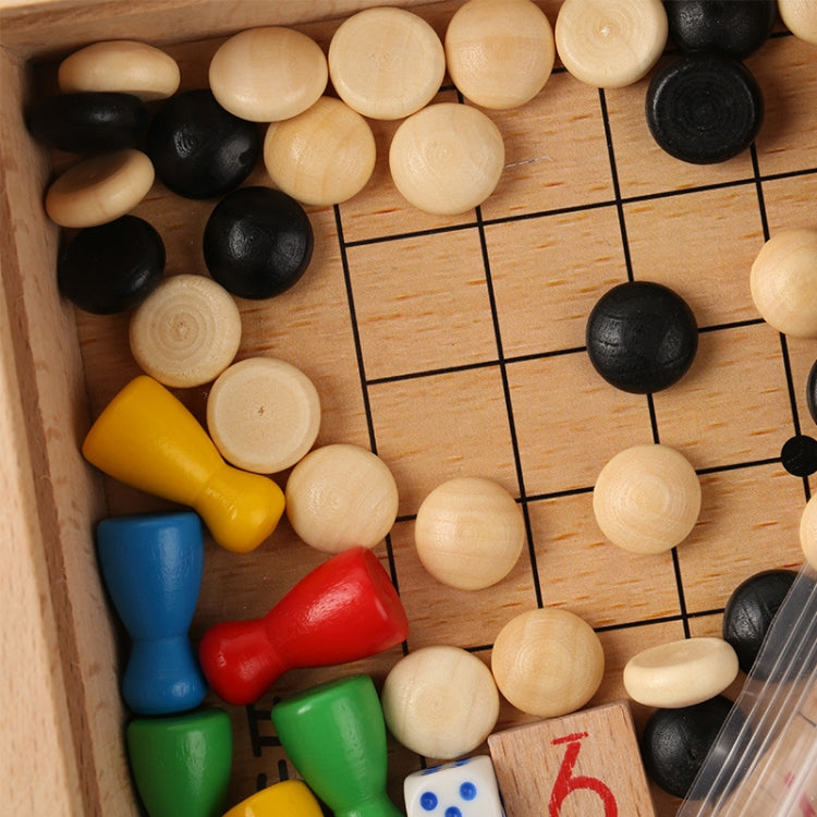Close-up wooden board game with colored pawns, wooden marbles, and black grid lines
