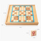 Wooden puzzle board with blue sudoku-style grid and small numbered tiles on top