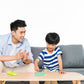 Parent and child playing with small silicone pop-it boards on a table
