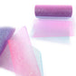Glitter net yarn roll in pink and purple gradient with dense glitter sparkle finish