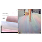Glitter net yarn roll fabric in light pink and blue, shown wrapped and layered