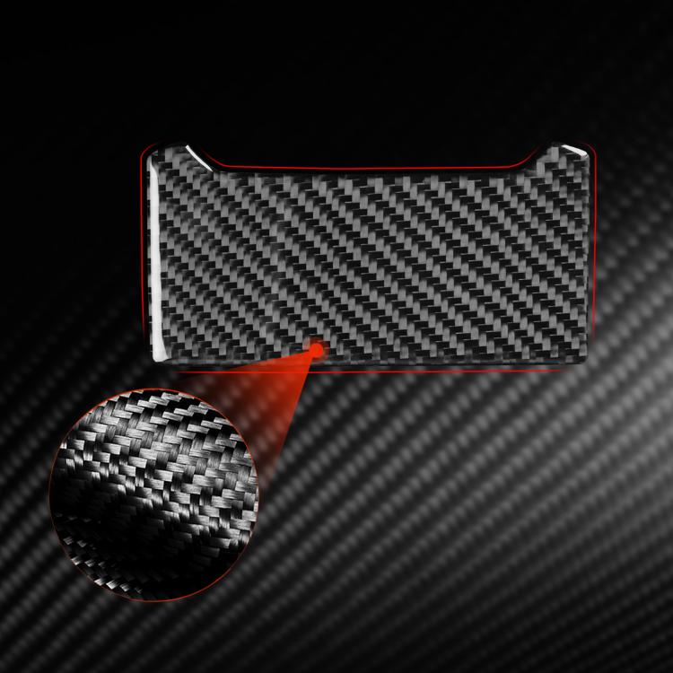 Black carbon-fiber charging port decorative sticker with textured woven pattern.