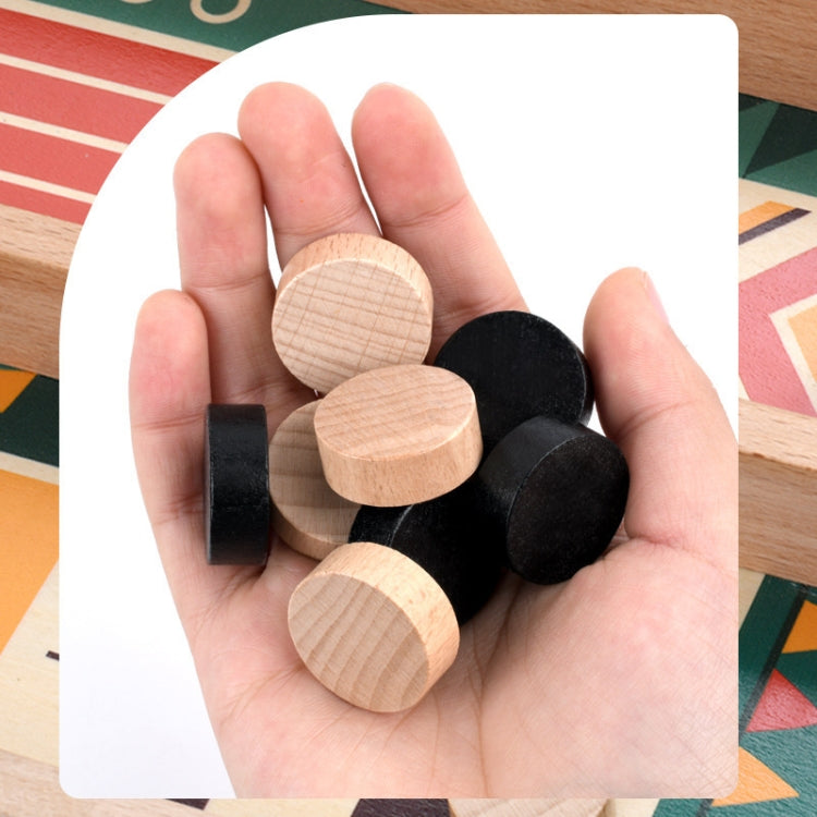 Wooden catapult chessboard game pieces: black disks and light wood round tokens