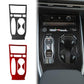 Carbon-fiber center console trim pieces set, showing black and red accents