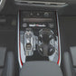 Red carbon-fiber gear shift side trim sticker strips on center console edges.