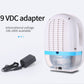 Mini dehumidifier with 9VDC adapter cable and blue bottom water tank window