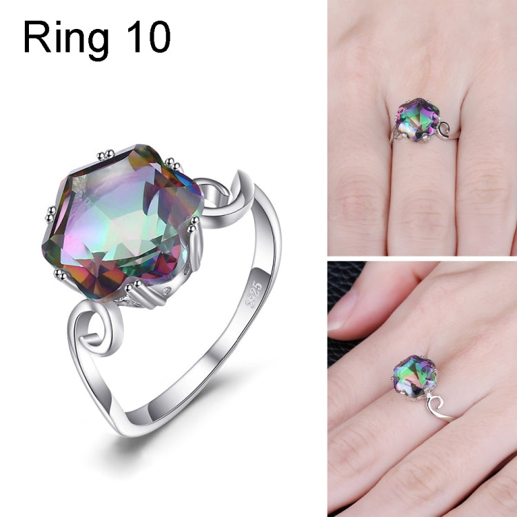 Sterling silver ring with large multicolor faceted gemstone and twisted detail on the band