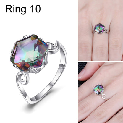 Sterling silver ring with large multicolor faceted gemstone and twisted detail on the band