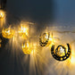 Eid LED string lights with crescent lantern cutouts; warm white glow along the line.