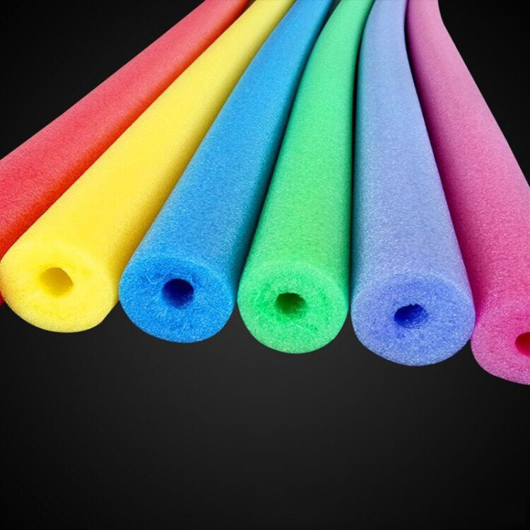 Assorted colorful foam swim sticks with circular holes at the ends
