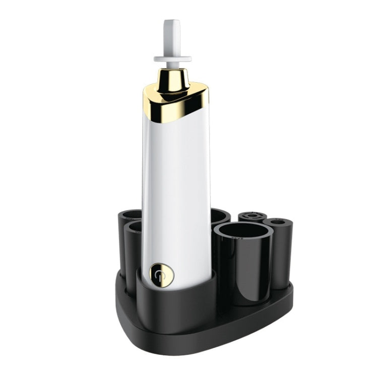 White electric makeup brush scrubber with gold cap and upright cleaning head on base