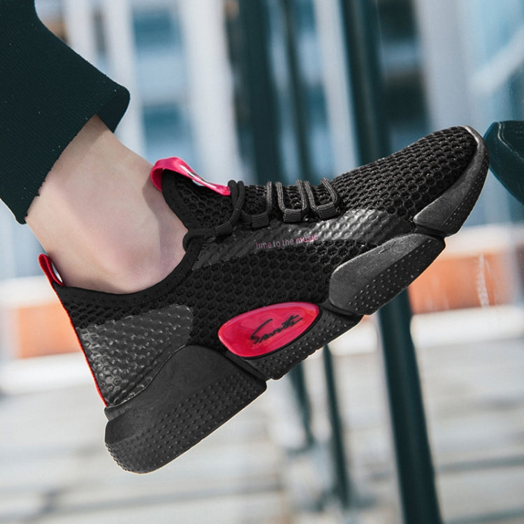 Black breathable knit running shoe with red logo patch and black laces