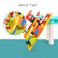 Colorful plastic block building set with track pieces and layered curved ramp