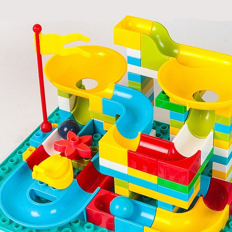 Colorful rotating track block building set with yellow platforms and teal base