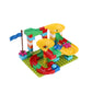 Kids block building playset with colorful pieces, track ramps, and yellow round platforms