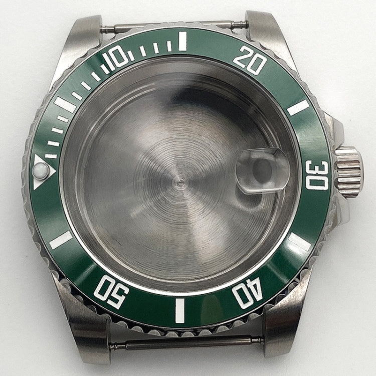 Stainless steel watch case with green rotating bezel and black minute markers