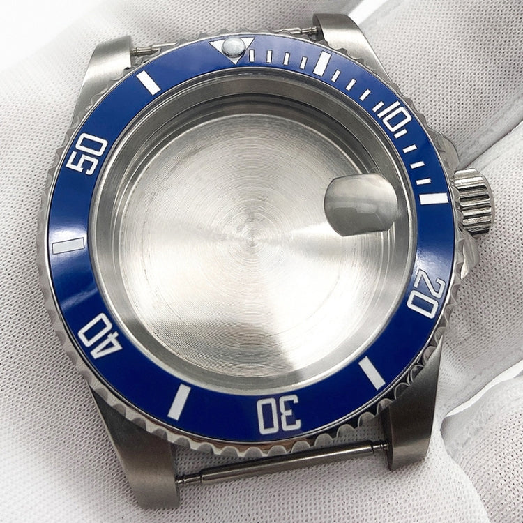 Stainless steel watch case with blue rotating bezel and black minute markers
