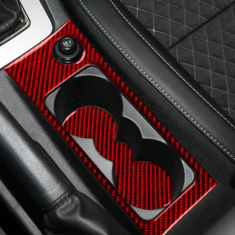 Red carbon-fiber cup holder insert with heart-shaped cutout mat in console