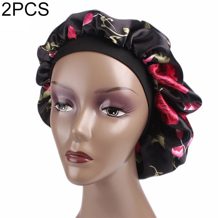 Women’s satin hair bonnet in black with pink rose floral print and wide elastic band