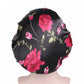 Women’s satin hair bonnet in black with magenta flower print and black elastic band
