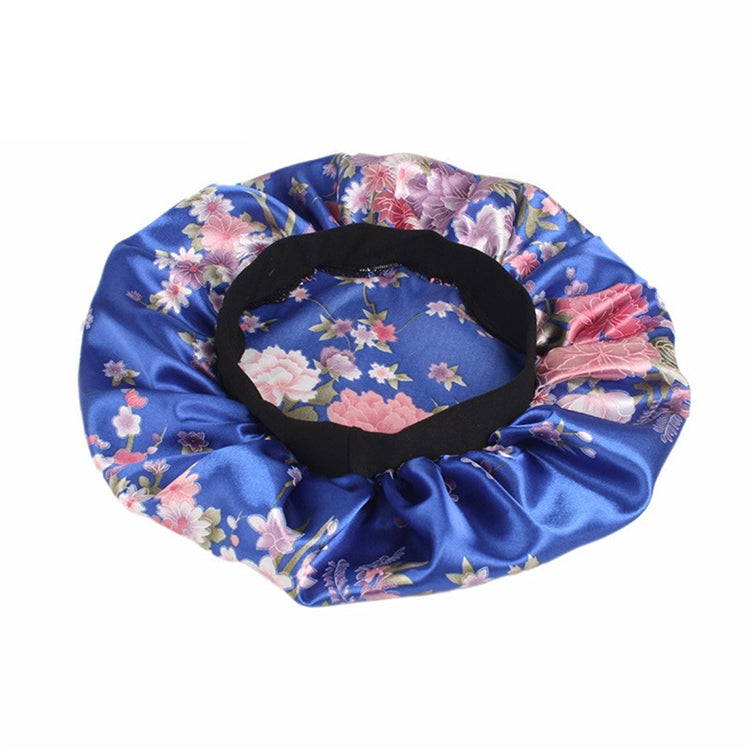 Women’s satin hair bonnet with blue floral print and black elastic opening band
