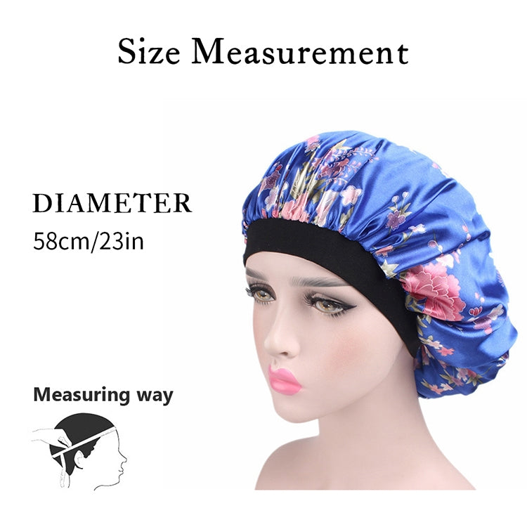 Women’s satin hair bonnet in blue with pink and white floral print and black elastic band