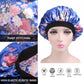 Women’s satin hair bonnet close-up: blue floral print with black elastic band