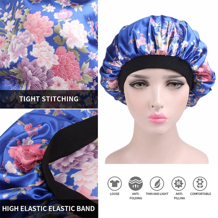 Women’s satin hair bonnet close-up: blue floral print with black elastic band