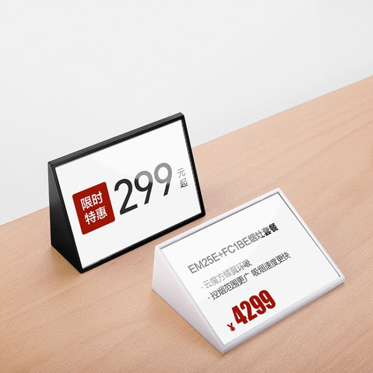 Black and white acrylic card stands on desk surface, price tag inserts shown
