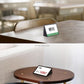 Black acrylic triangle desk price tag sign on a tabletop