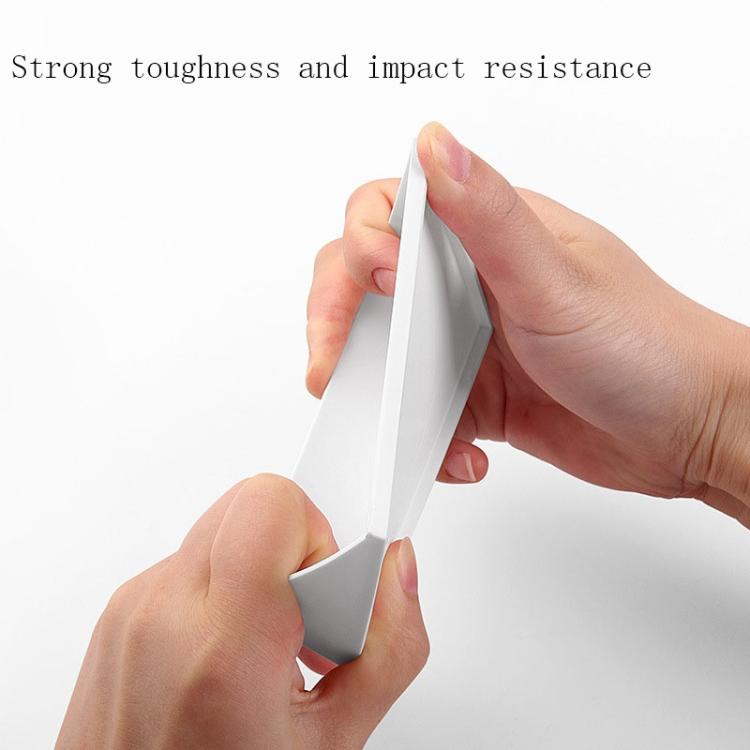 Hands holding and flexing white acrylic card stand side edge, showing durability