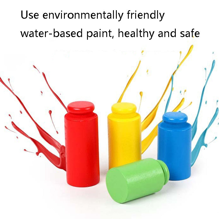 Colorful painted balance scale weight cylinders in red, yellow, blue, and green