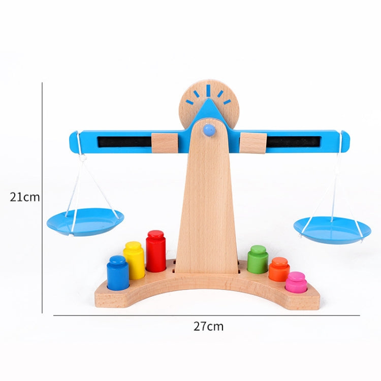 Standing wooden balance scale with blue beam, hanging plates, and colorful cylinder weights
