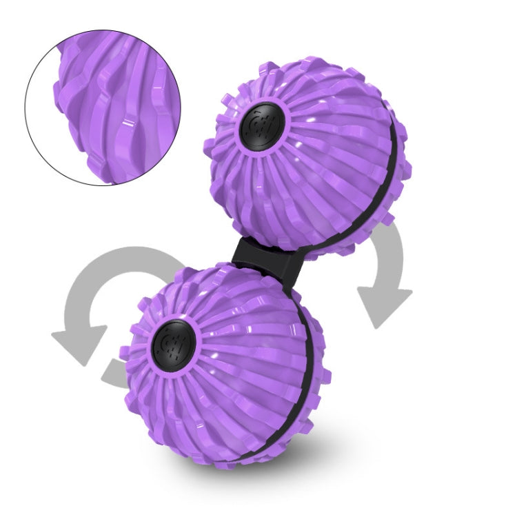 Purple fingertip massage ball pair with black spin caps and rotation arrows