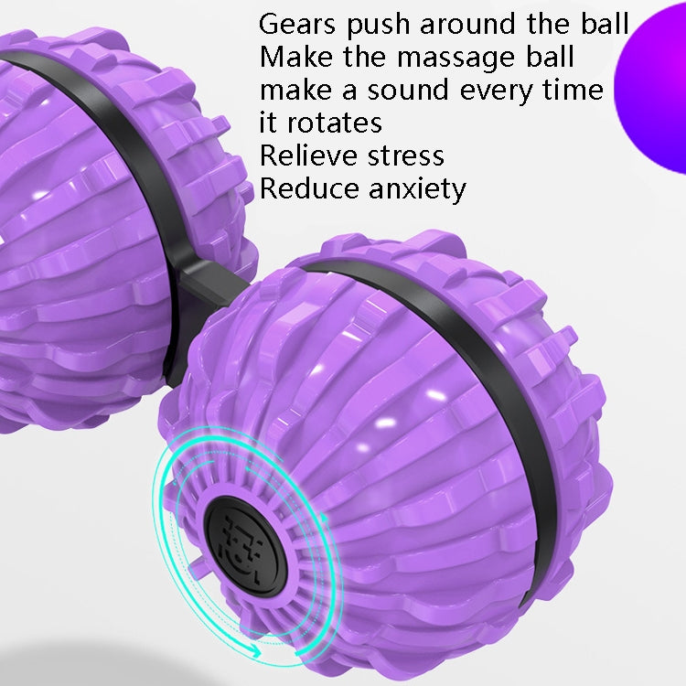 Close-up of a purple fingertip massage ball with black rim and spin cap