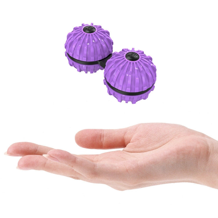 Purple fingertip massage ball spinners held in a hand, two-pack