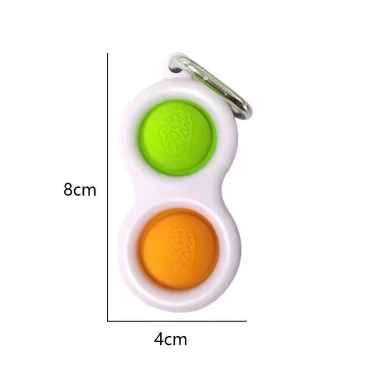Finger fidget keychain with green and orange press pads, silver key ring