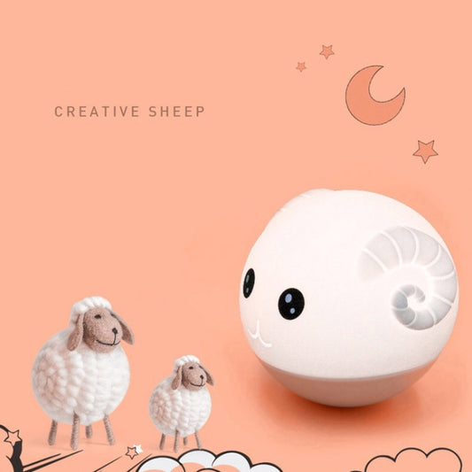 White round silicone animal night light with smiling face and soft glow
