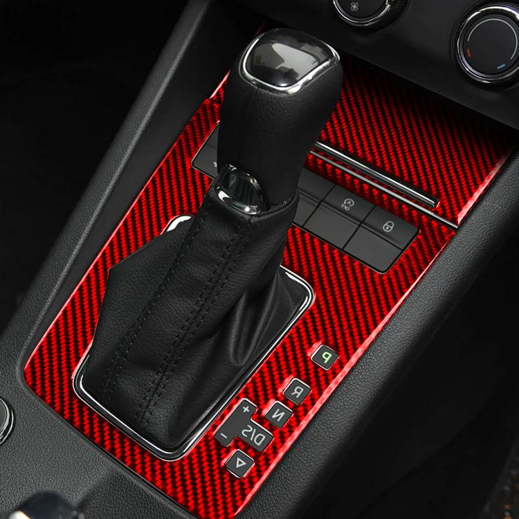 Red carbon-fiber gear shift panel trim with black boot and button cutouts