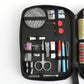 Sewing kit case panel with circular thread spool, red-handled tools, and clips