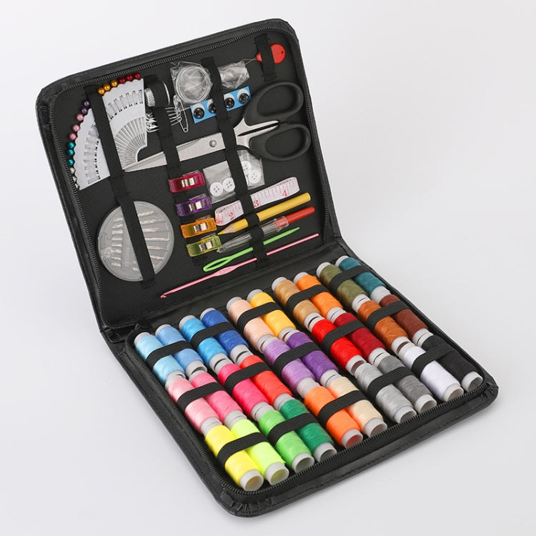 Portable sewing kit case with colorful thread spools, scissors, needles, and tools in black organizer