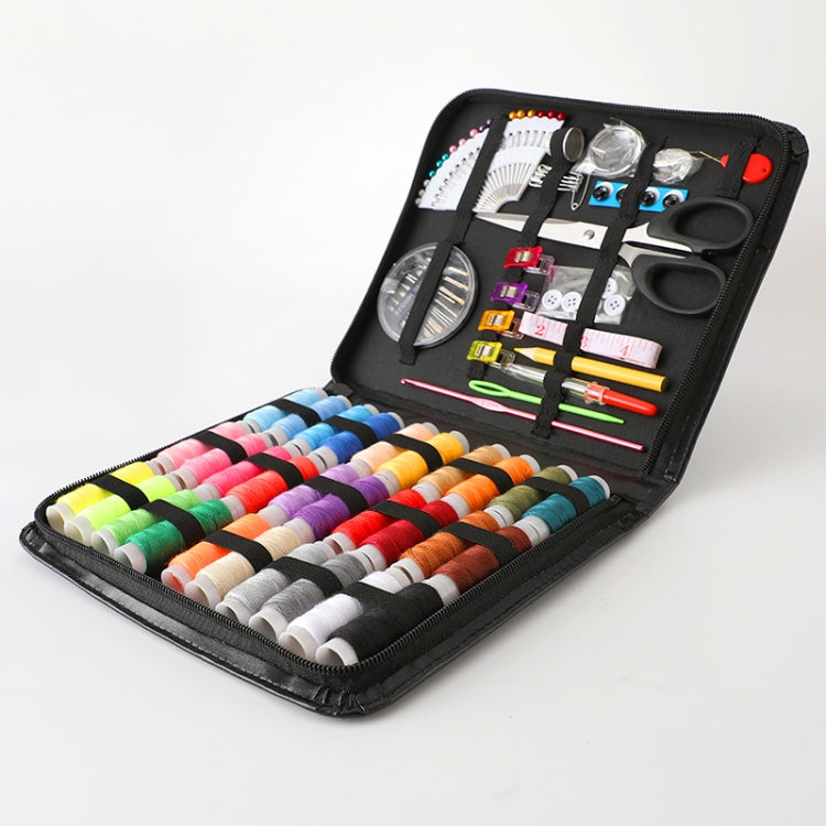 Portable sewing kit case laid open, showing colorful thread spools and assorted sewing tools