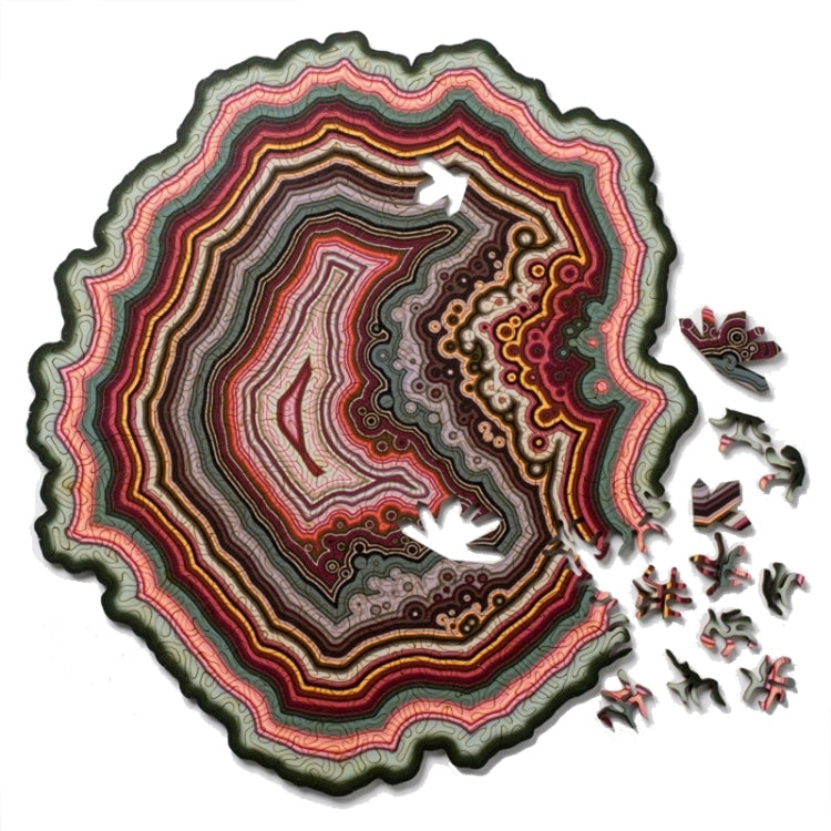 Wooden jigsaw puzzle with multicolor agate-style pattern and scattered puzzle pieces