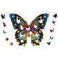 Wooden butterfly 3D puzzle with pieces scattered around the colorful butterfly