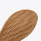 Tan sandal sole with textured braided pattern and rounded toe edge