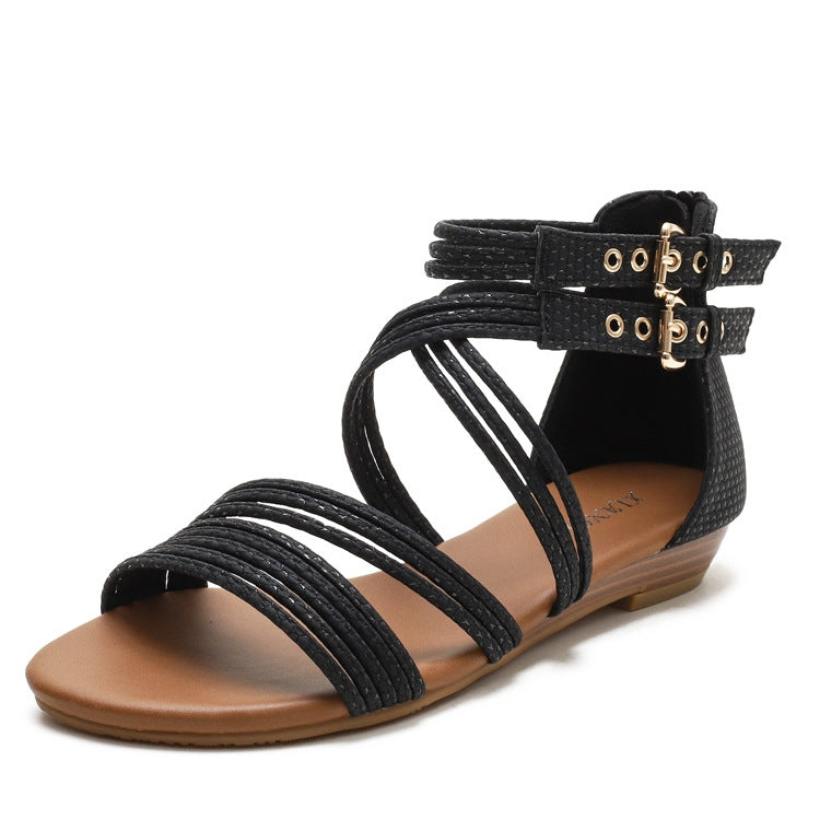 Women's black open-toe wedge sandals with crisscross Roman straps and ankle buckle.