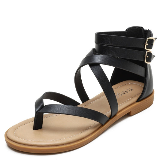 Black side-view strappy cross-strap low heeled sandals with two ankle buckles