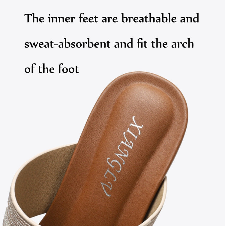 Close-up of tan footbed inside champagne slide sandals with cushioned arch support