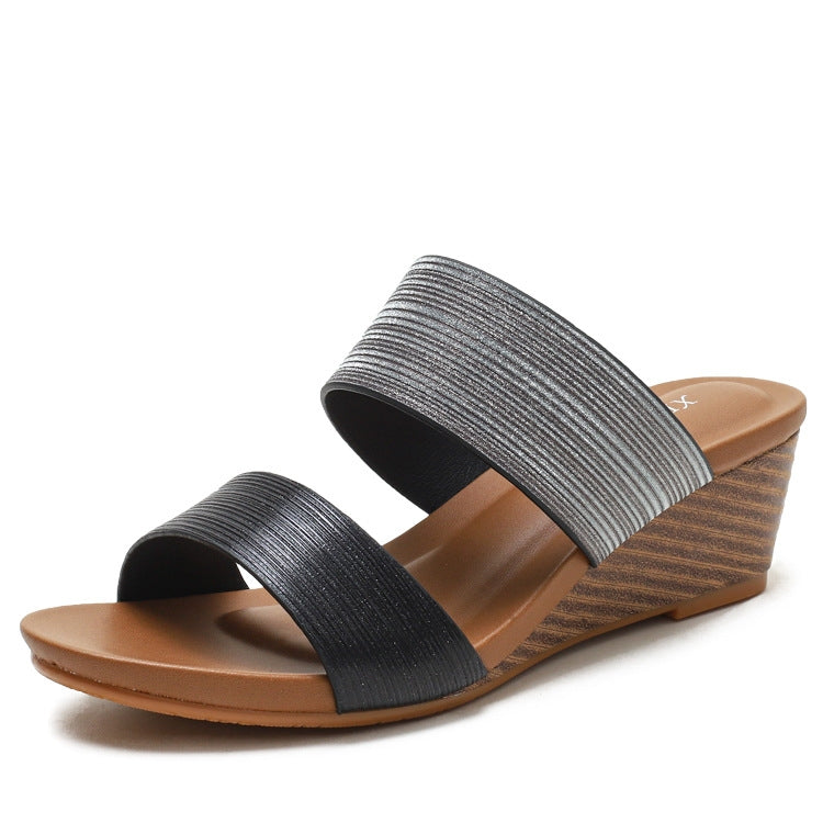 Black-and-gray strappy platform wedge slide sandals, angled front view