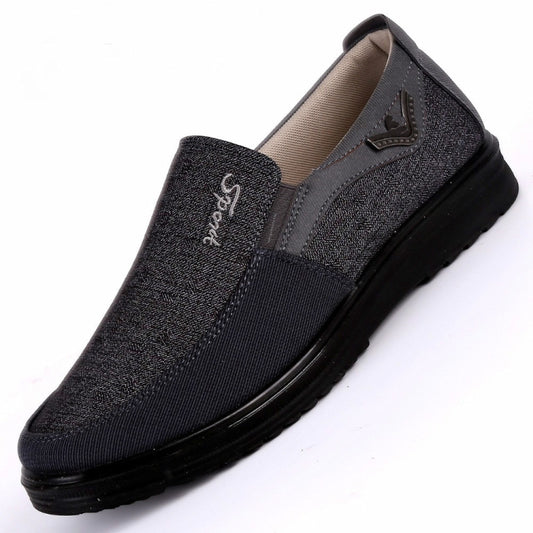 Men's low-cut slip-on flat shoe, dark gray textile upper with beige lining and rubber sole